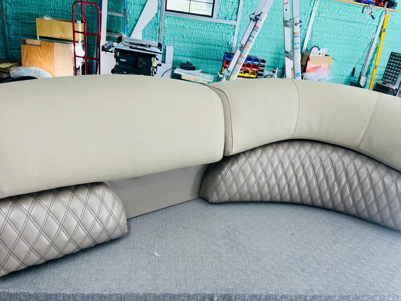 Curved boat bench upholstery with diamond stitched lower panel