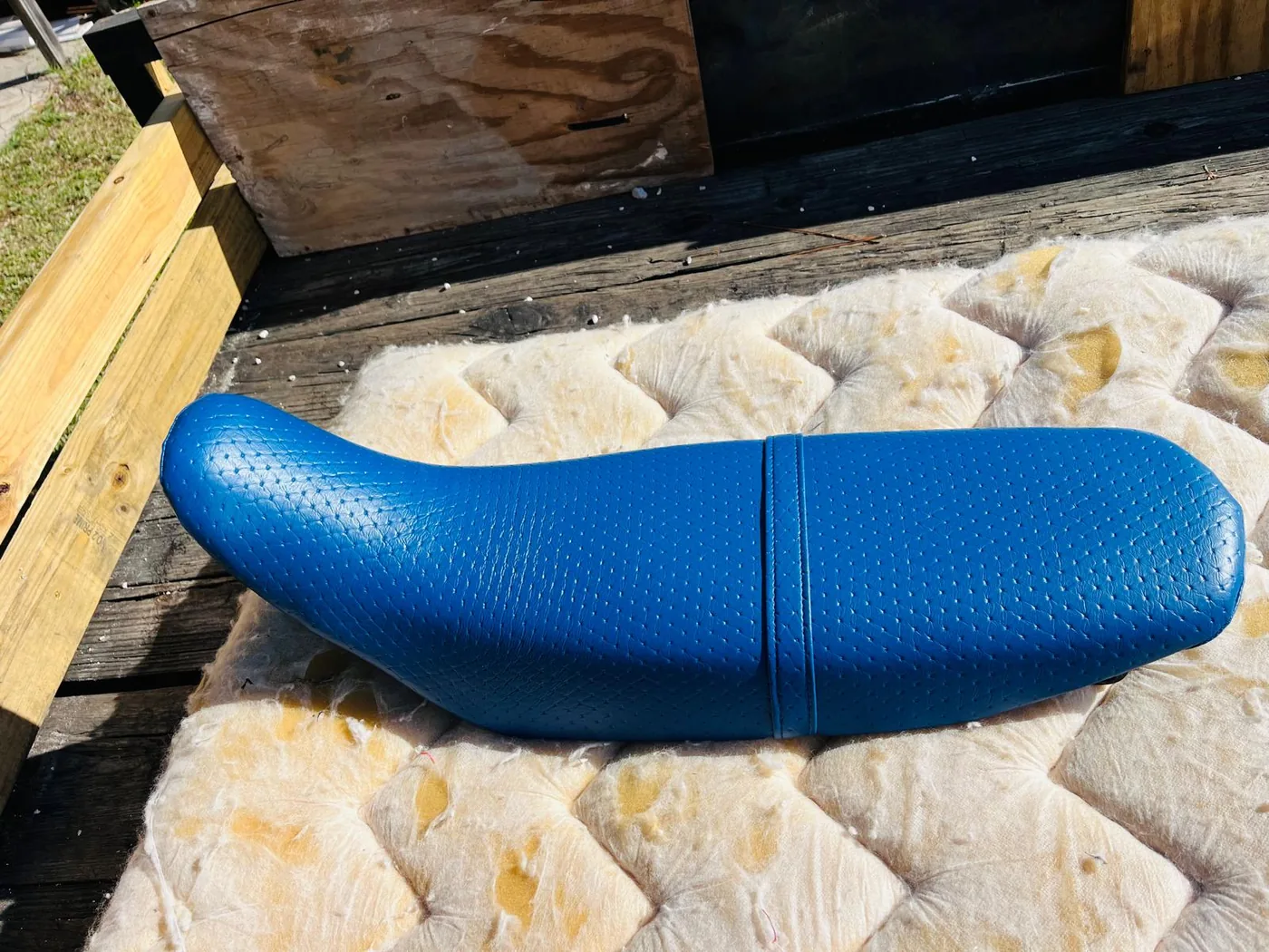 Blue custom boat seat with patterned marine vinyl