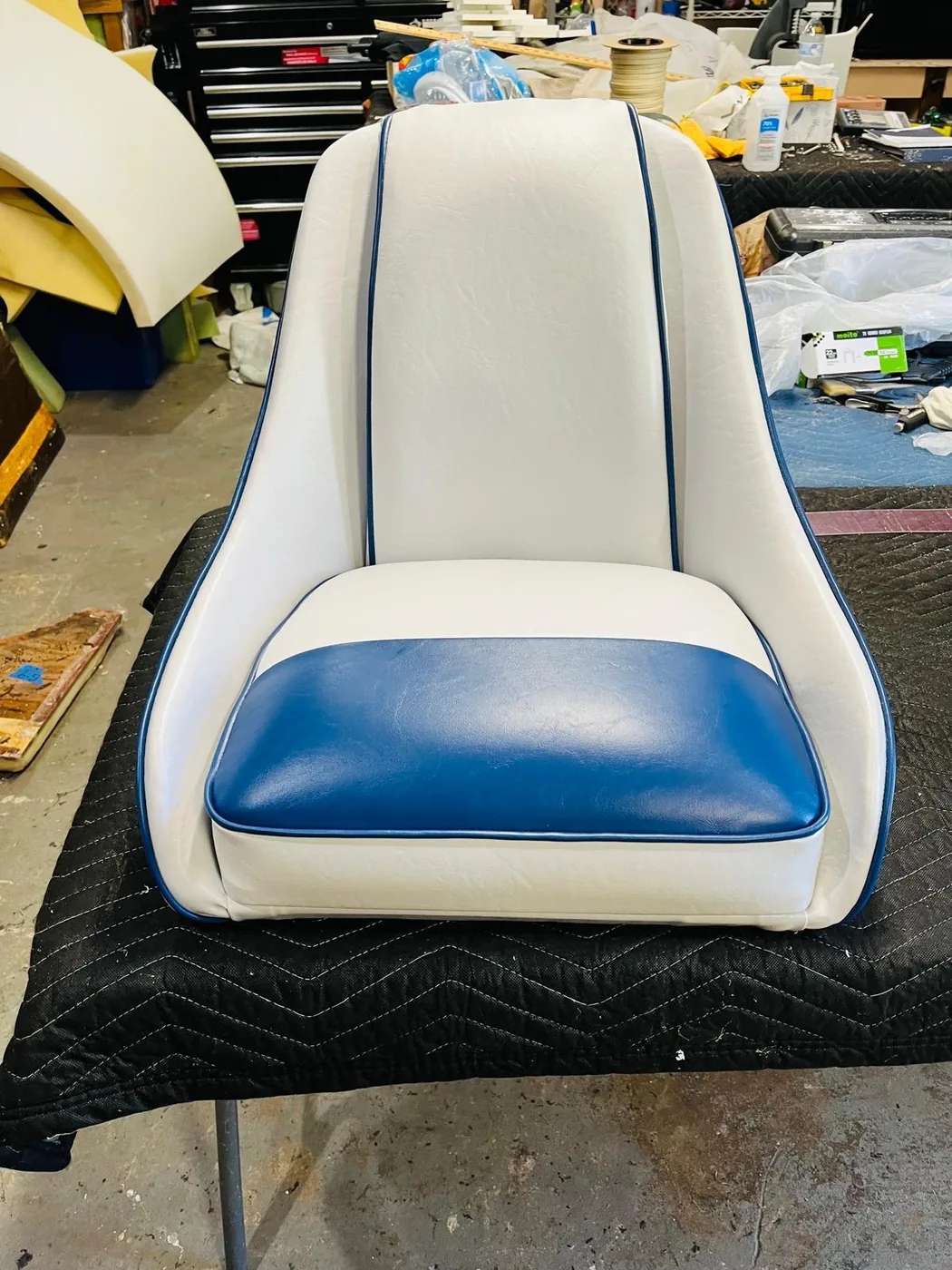 White and blue marine chair upholstery with piping detail